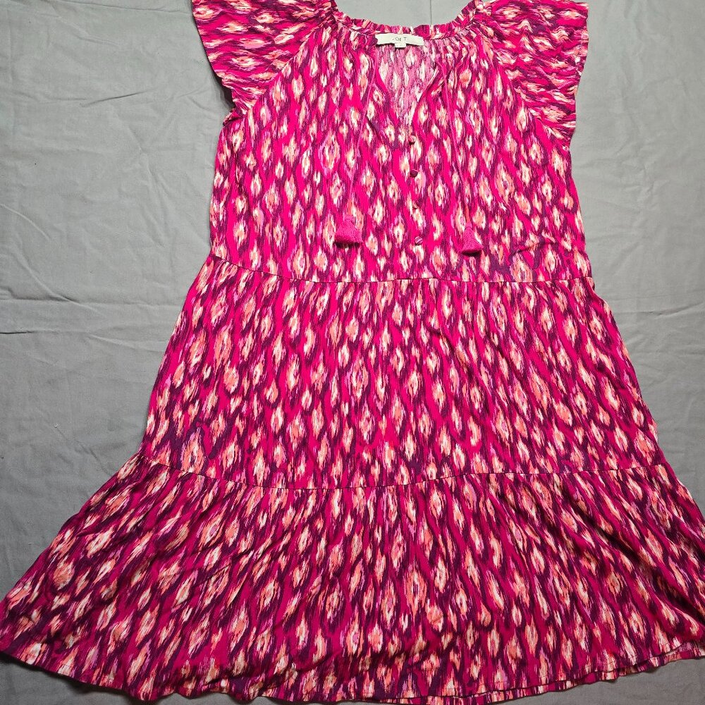 The Loft Linen Blend Romper in White with a Blue Flower Print is a stylish and v